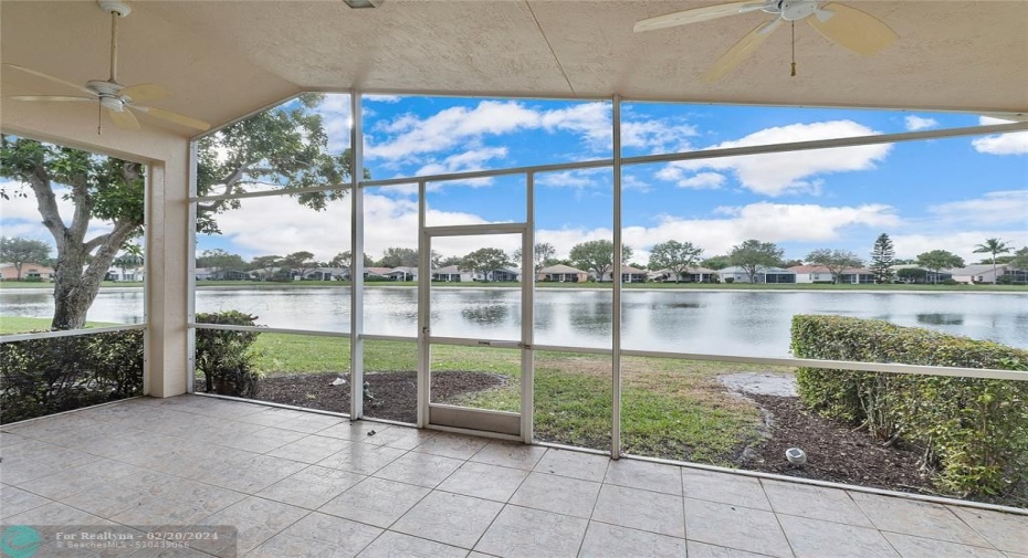 Covered and screened patio with vaulted roof overlooking the serene lakeview