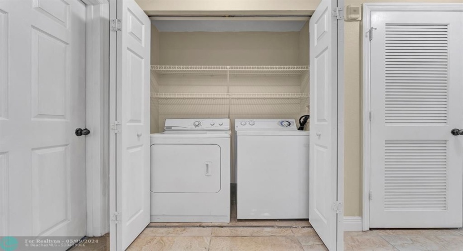 Laundry closet inside your condo for your convenience!