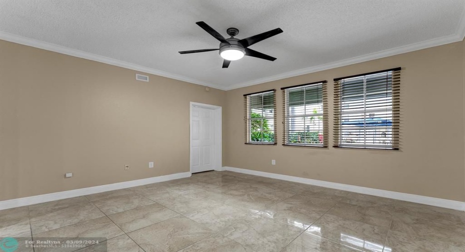 Spacious family living with lots of natural light & pool views !