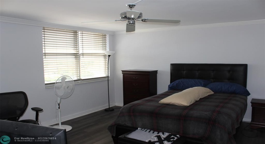 Master bedroom with ceiling fan.