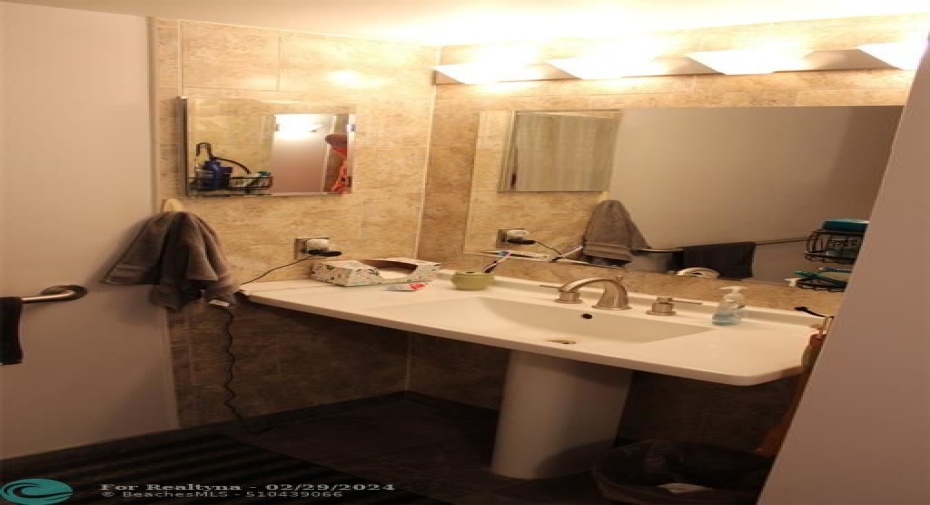 Master pedestal sink & mirror.