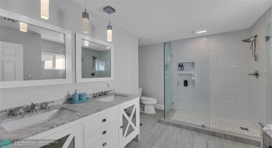 Master Bathroom features double vanity with huge walk in shower and quartz counters