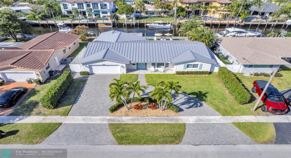 Nicely landscaped and fully fenced backyard on the water in Lighthouse Point