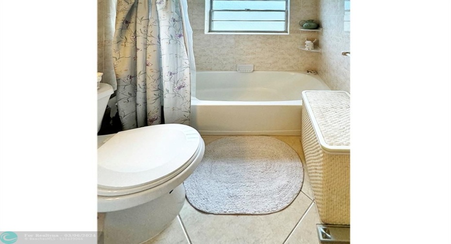 Tiled Walls in Tub/Shower of Primary Bath w/Outside Window.
