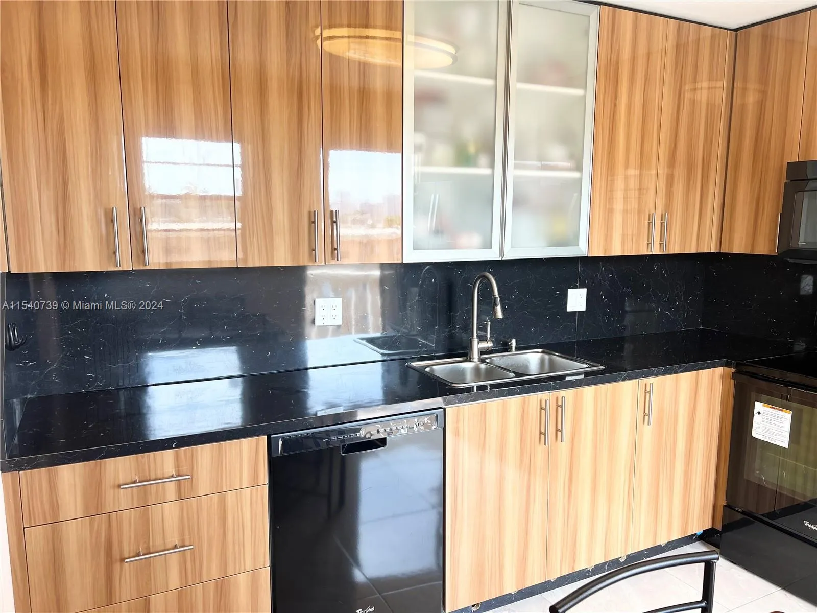 Beautiful modern Italian eat-in kitchen. Custom cabinetry till the ceiling. Fully integrated organizational/storage system cabinetry and plenty of countertop space.