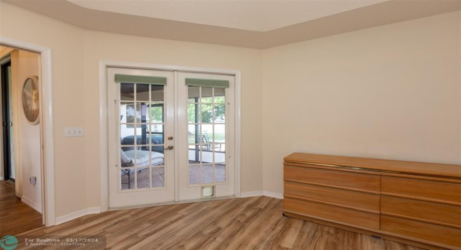 French doors leading to the covered lanai and backyard.