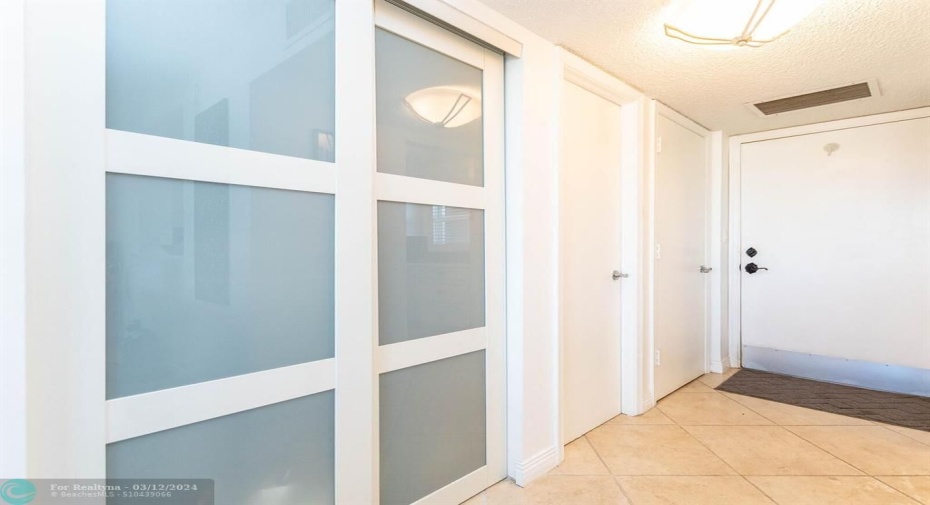 Foyer entrance with 1/2 bath and closet