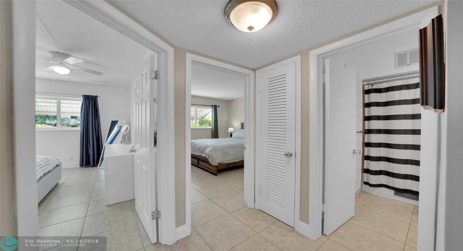 Hallway to bedrooms, bathrooms and linen closet