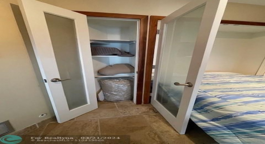 To the left of the Murphy bed is a closet.