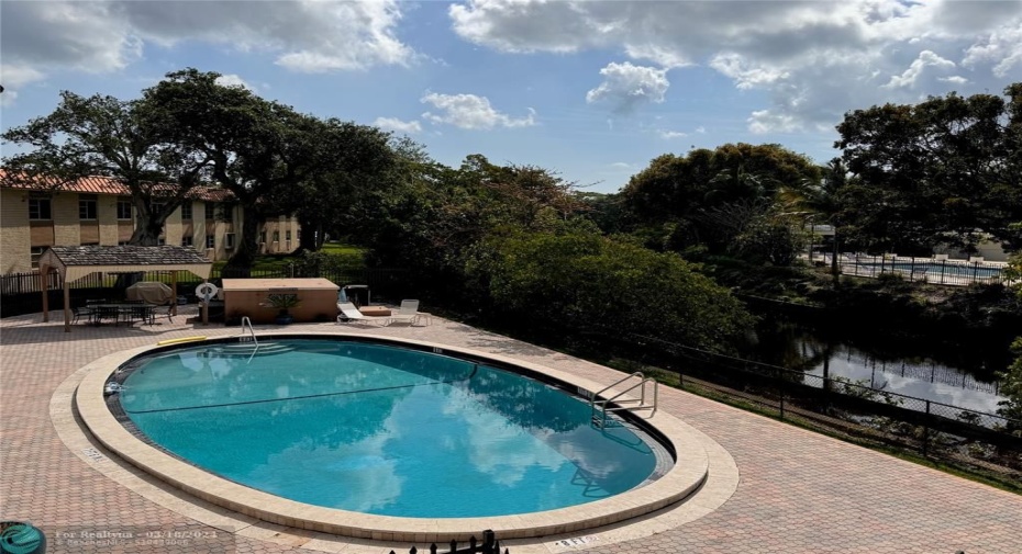 Pool and sundeck nestled on Wilton Manors Middle River...