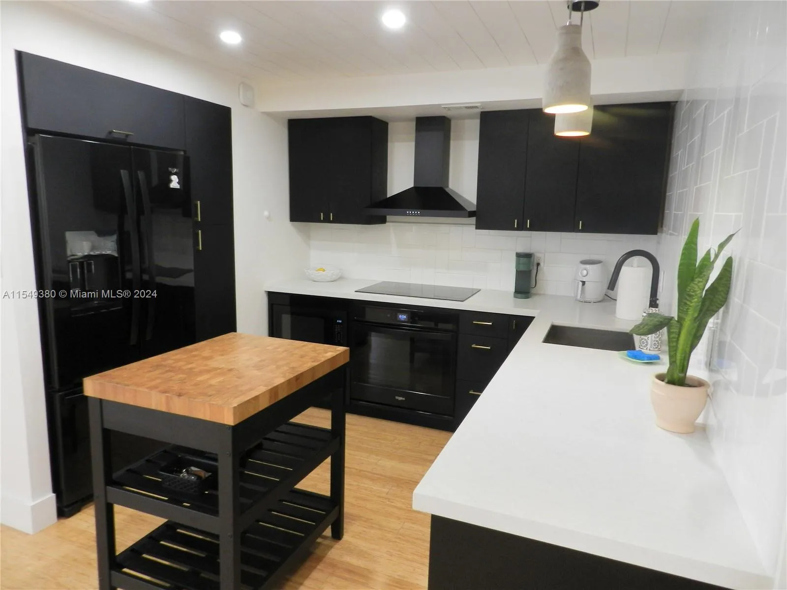 Gorgeous fully remodeled kitchen with quartz counters and upgraded appliances