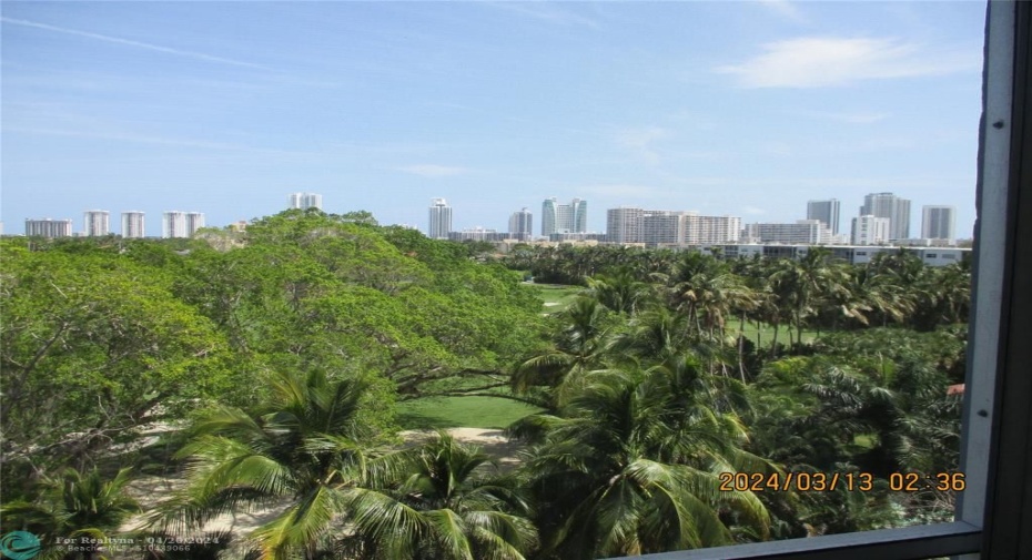 Screened terrace faces east to the beach