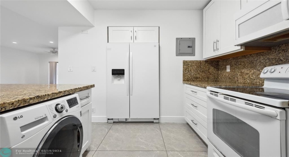 Kitchen with Washer/Dryer Combo In Unit