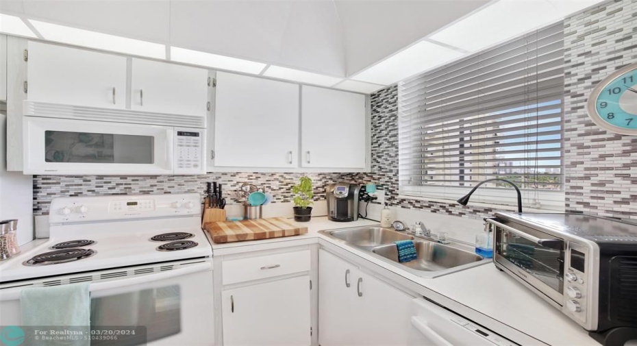 KITCHEN WITH ALL WHITE CABINETS AND APPLIANCES