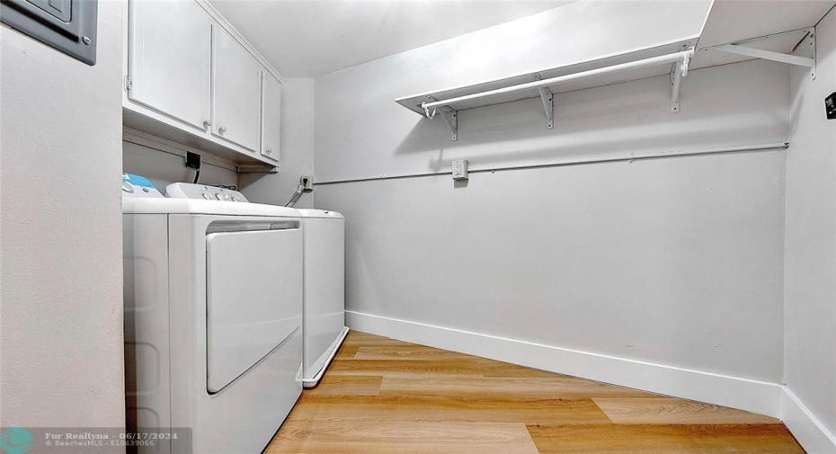 Large utility room with full size washer & dryer