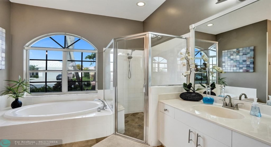 Imagine stepping into a spa-like sanctuary, a retreat dedicated to ultimate relaxation. This master bathroom isn't just functional; it's a haven designed to melt away stress and soothe the soul.