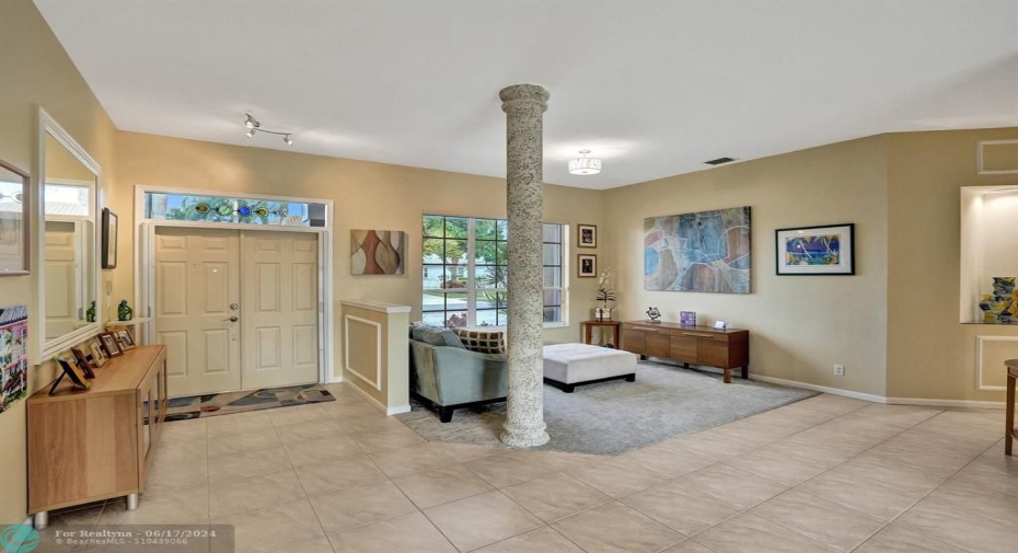 Step through the front door and be greeted by a light-filled foyer, the heart of this warm and inviting home.