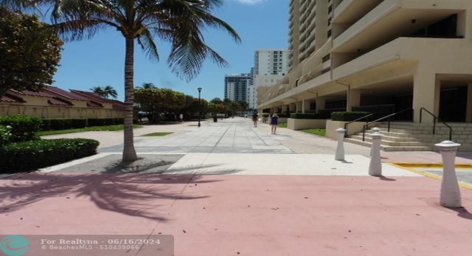 Promenade between building & pool area.