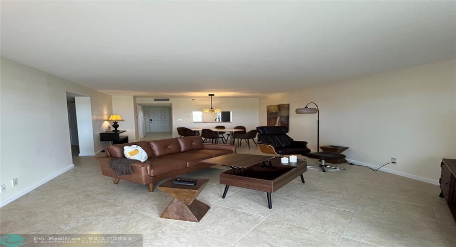 Large living room/dining room with comfortable furniture