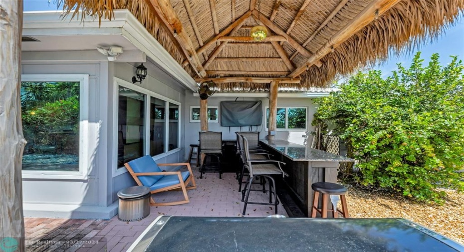 Outdoor bar area is ideal for entertaining or vacation home