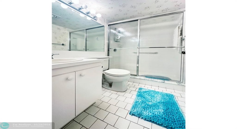 Updated Primary Bathroom Features Shower Stall w/Glass Doors