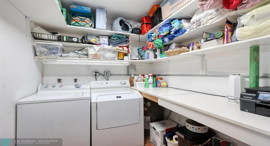 Very large laundry room with storage