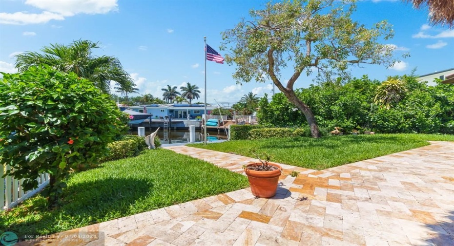 Colorful travertine walkway to dock and back patio area.