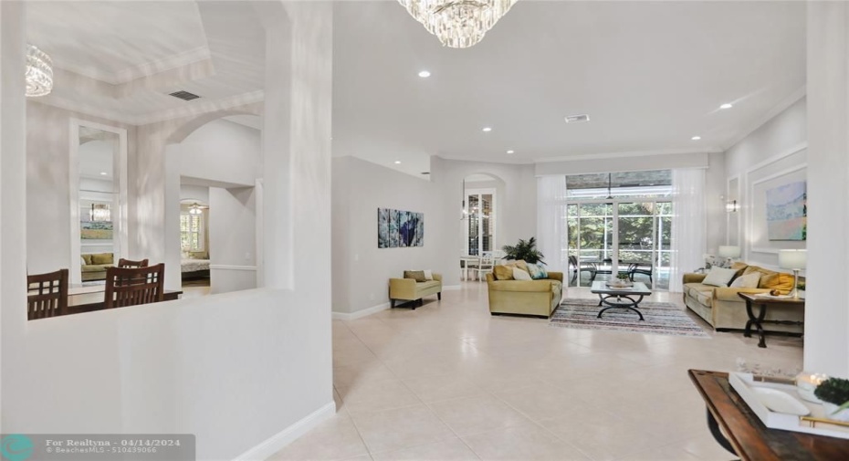 Spacious formal entry with sparkling chandelier, recently painted interior, high volume ceilings.