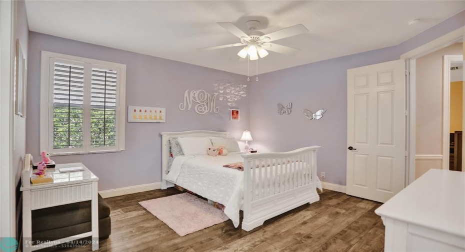 Bedroom #2 is a sweet as it get, with plantation shutters, newer flooring, large custom walk-in closet.