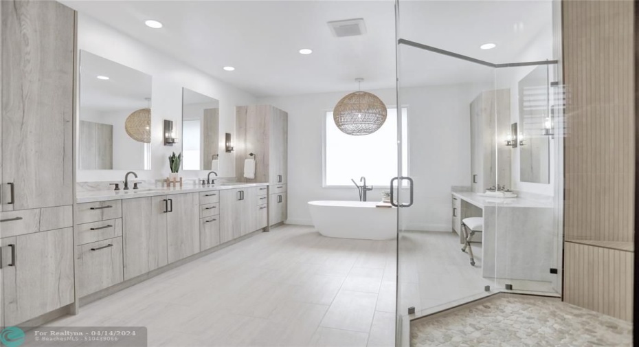 Stunning remodeled master bath includes high-end Quartzite countertops, high impact frosted glass window, recessed LED lighting, custom finishes