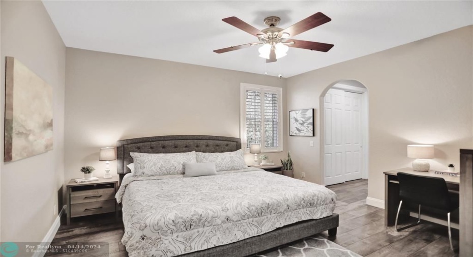 Bed #4 with  luxury vinyl plank flooring, plantation shutters, a large walk-in closet plus another spacious closet.