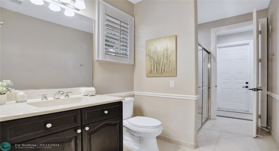 Bathroom #3 leads to another door with direct access to the outdoor patio.
