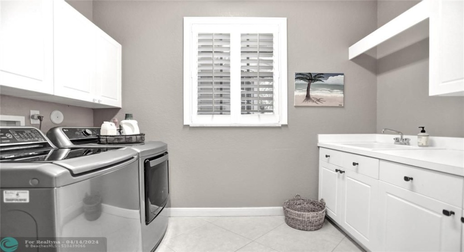 Washer/dryer 2023, lots of cabinetry for storage, plantation shutters