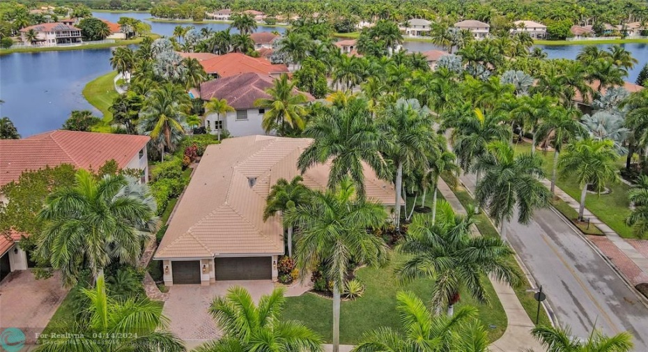 Large corner lot, 14,573 sf, flanked with stately palm trees. Only 3 small roads in this prestigious enclave, all ending culdesacs.