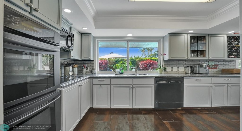 large kitchen with a pass through window to your back yard.