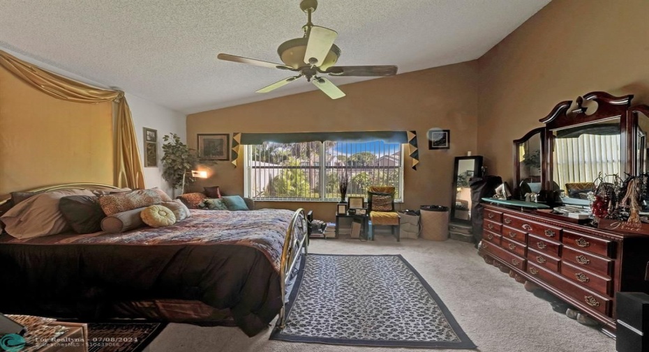 A Place to Recharge:  This master bedroom is more than just a sleeping space – it’s a sanctuary for relaxation and quality time together.  Imagine curling up with a good book in the cozy armchair, or sharing a cup of coffee in bed while enjoying the view. This tranquil retreat is the perfect place to unwind, reconnect, and recharge.