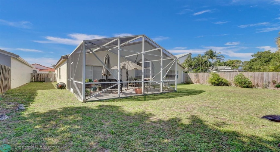 Safe and Sound:  Let your little ones run around and play freely in this fully fenced backyard – a haven for them to explore and expend energy  knowing they’re safe and secure.  The screened-in patio provides a cool, breezy escape from the hot Florida sun, while keeping out pesky bugs  so the fun can continue uninterrupted.