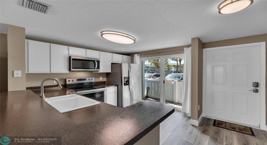 Kitchen is upon entry into townhome and is open and spacious