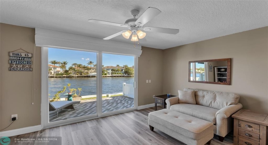 Living room with tons of natural light and water views