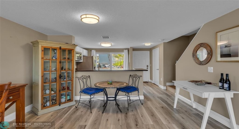 Dining room with open bar top into kitchen is perfect for entertaining