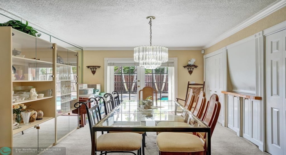 Enjoy dining with French doors that open to your private pool & backyard.