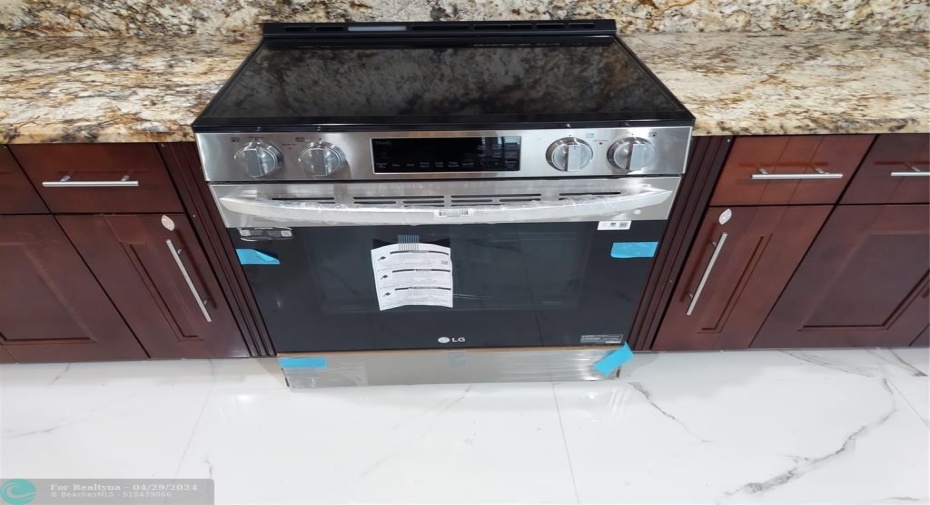 brand new LG slide-in stove, never used
