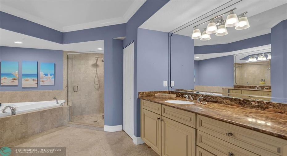 Large Owners bath with whirlpool tub, separate shower and two separate vanities.