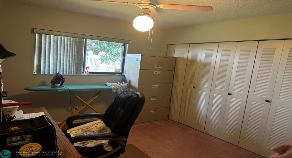 Spacious 3rd bedroom used as an office.