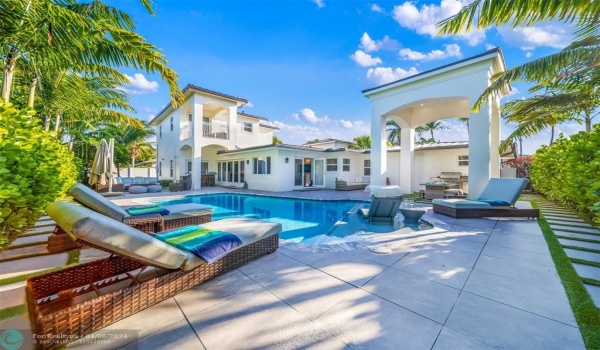 Backyard appointed with heated saltwater pool, lounge in the sun or enjoy a dinner with friends under the covered patio, trully a luxurious zen space.