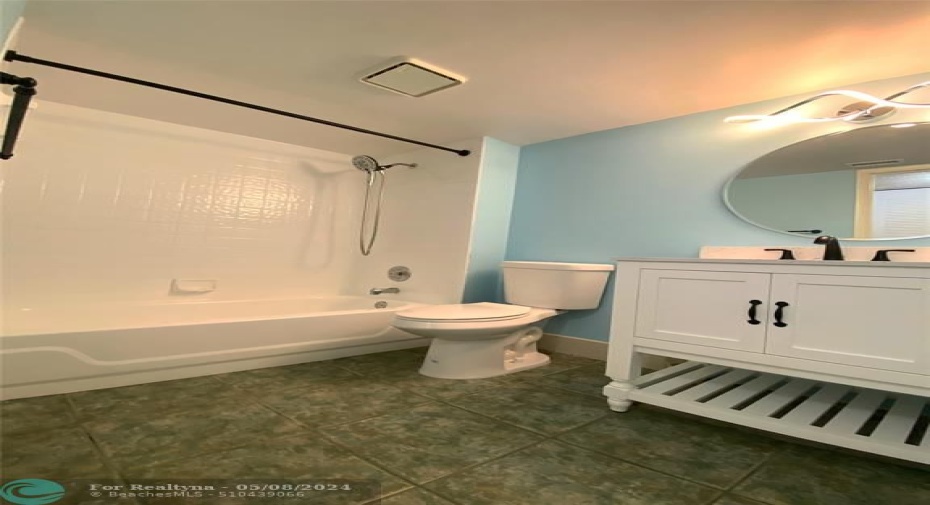 Tub and Shower in second bathroom.
