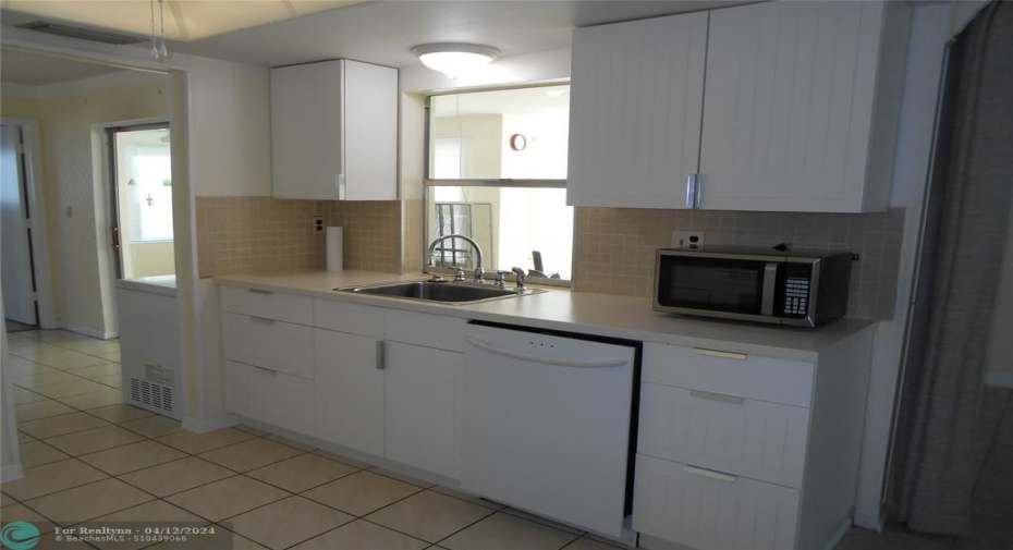 Kitchen has been updated with beautiful white cabinets and a quartz countertop