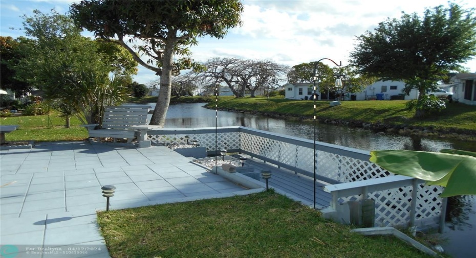 Back patio in addition to the Florida Room overlooking the canal