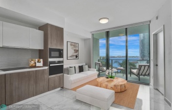 Staged living area with direct views of the bay