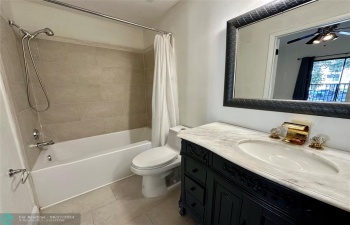 Renovated with new tiles, vanity, mirror , faucets & lights